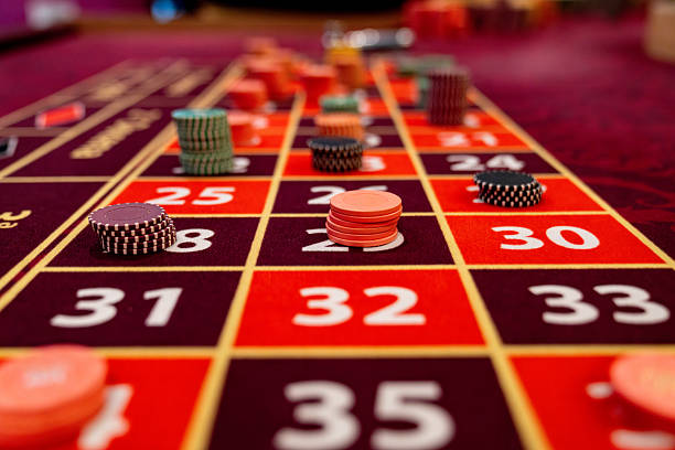 Mobile phone showing Treasures Aztec bet selection and spin button